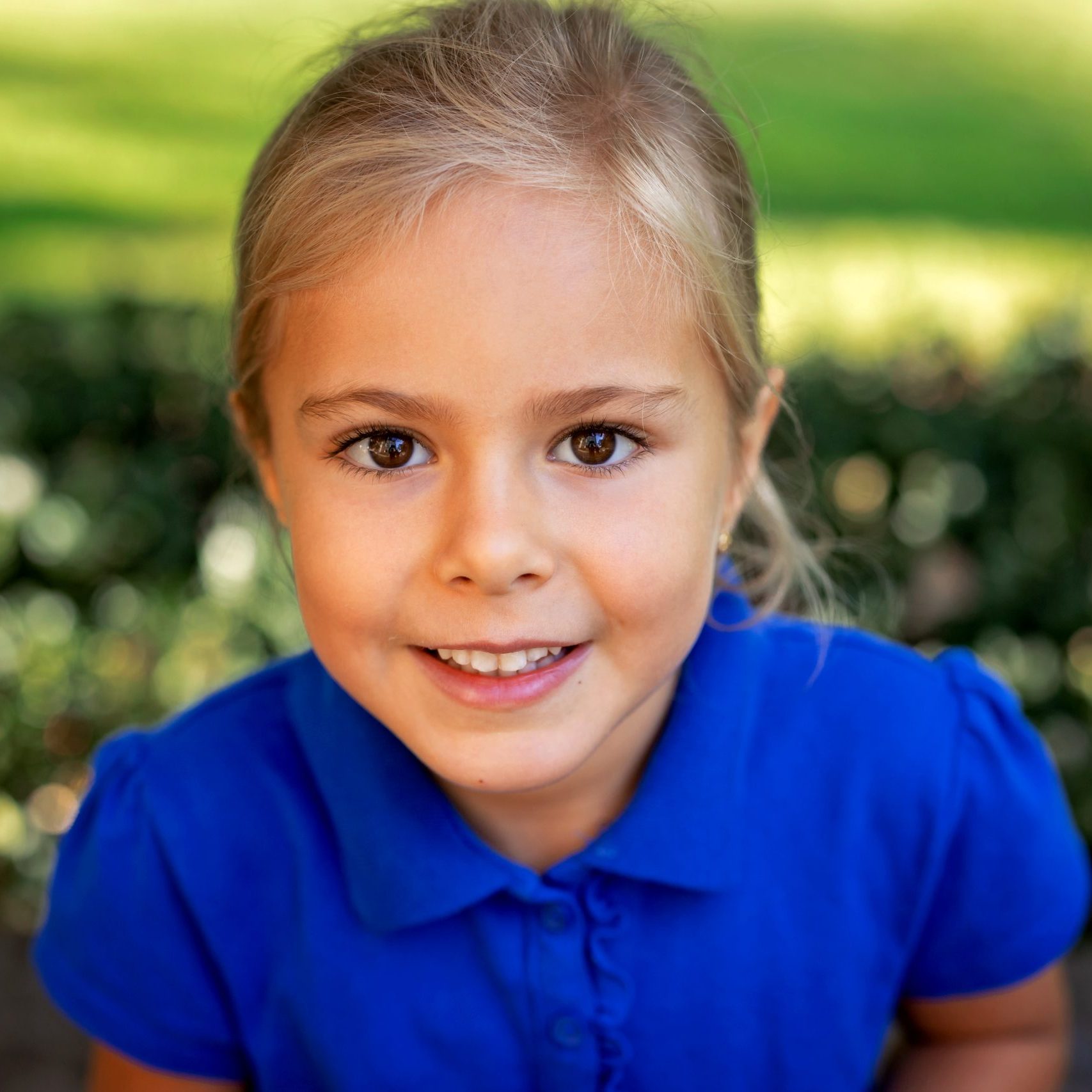 School Picture taken outside of Pittsburgh school showing blonde girl in blue shirt